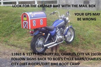 Cruiser bike with a barn-shaped mailbox marking the CCDR entrance on Roxbury Road