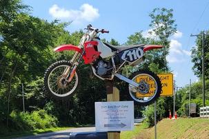 Dirt bike mounted on a pole marking the CCDR entrance