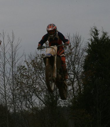 Rider jumping between the trees