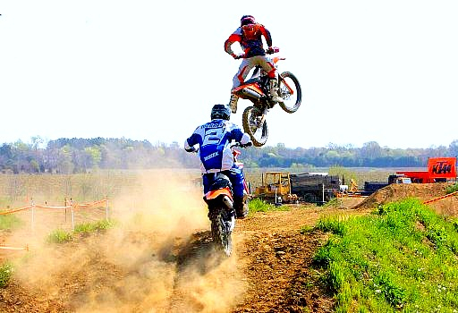 Two riders launching off a jump at CCDR